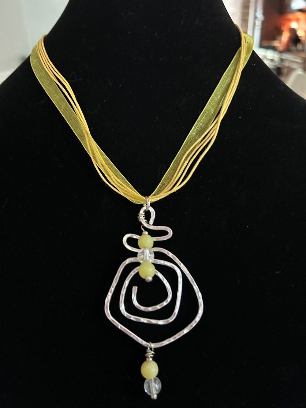 Yellow Multi-Strand Ribbon Necklace with Silver Spiral Pendant